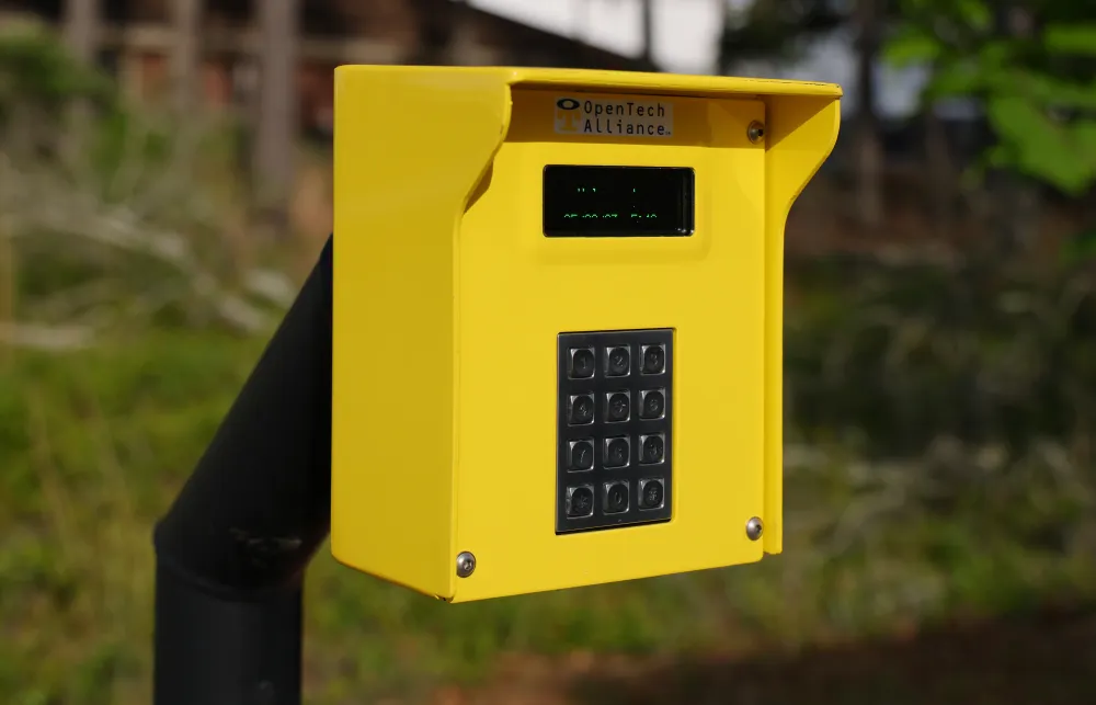 a yellow mailbox on a pole