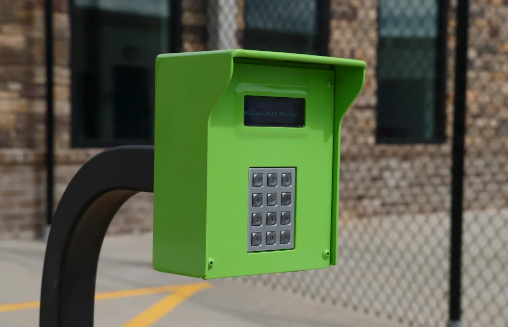 a green and white telephone booth