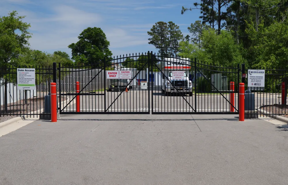 a road with a fence and a truck on it