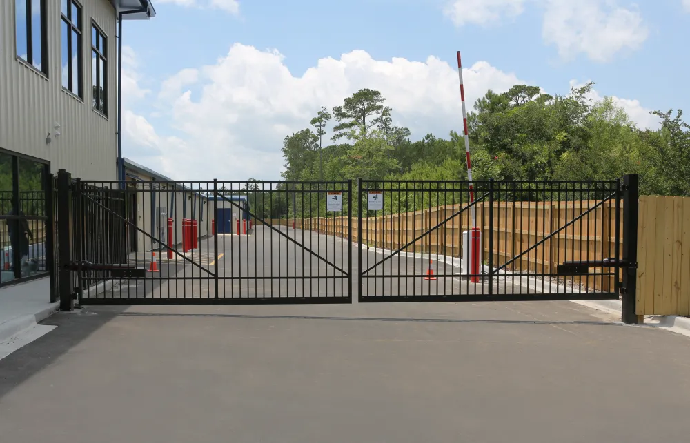 a black fence with a metal gate