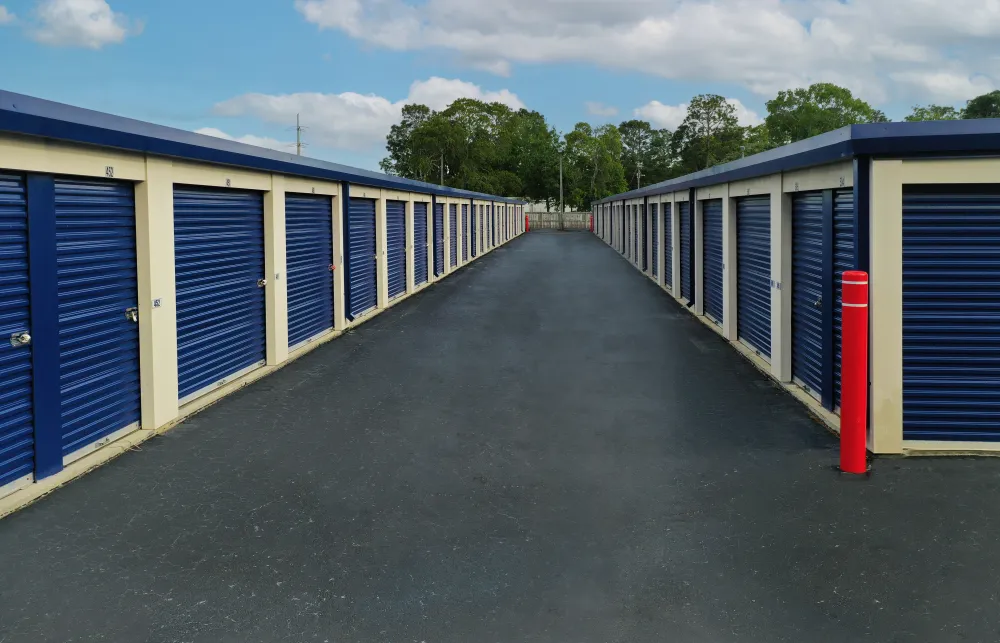 a row of blue and white sheds