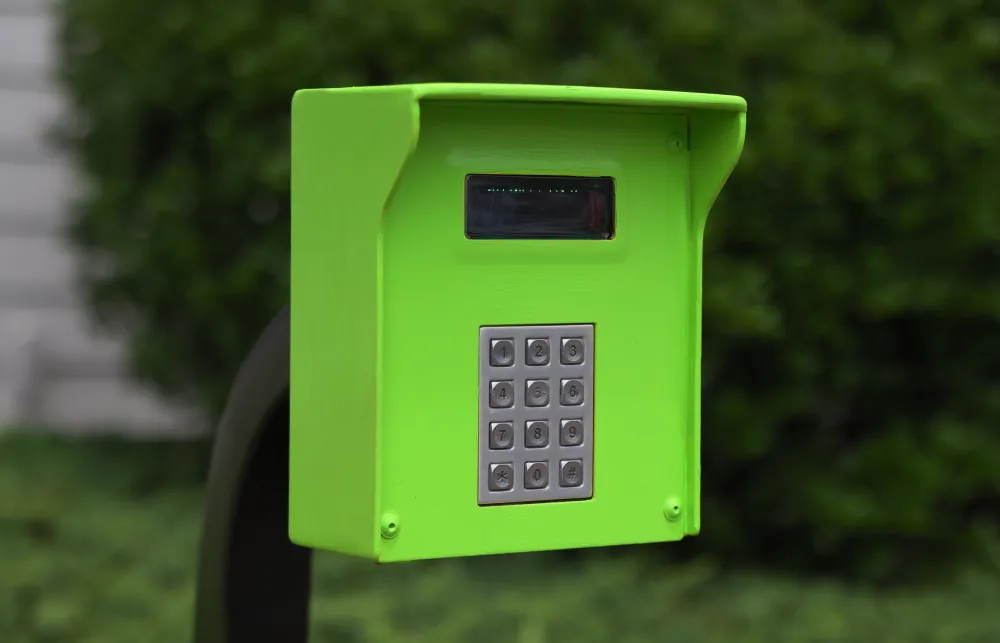 a green phone on a green box