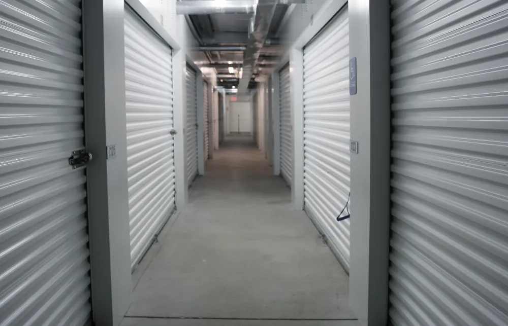 a hallway with white lockers