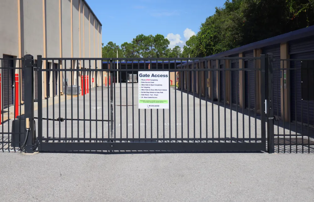 a black gate with a sign on it