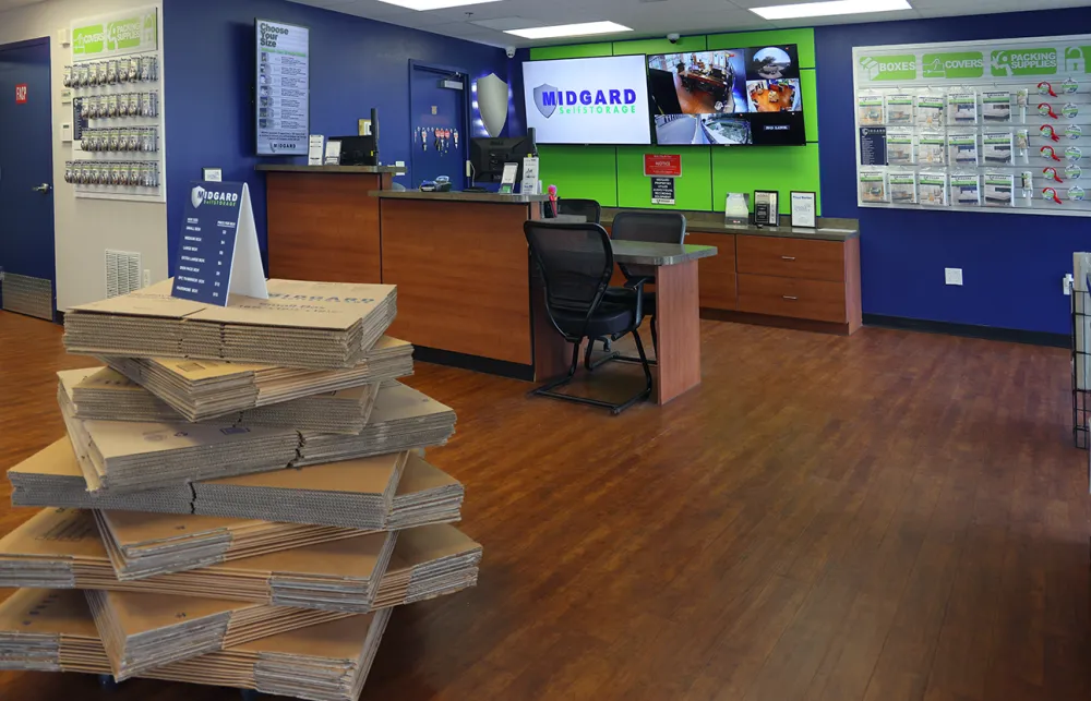 a room with a desk and a chair and a large stack of wood blocks