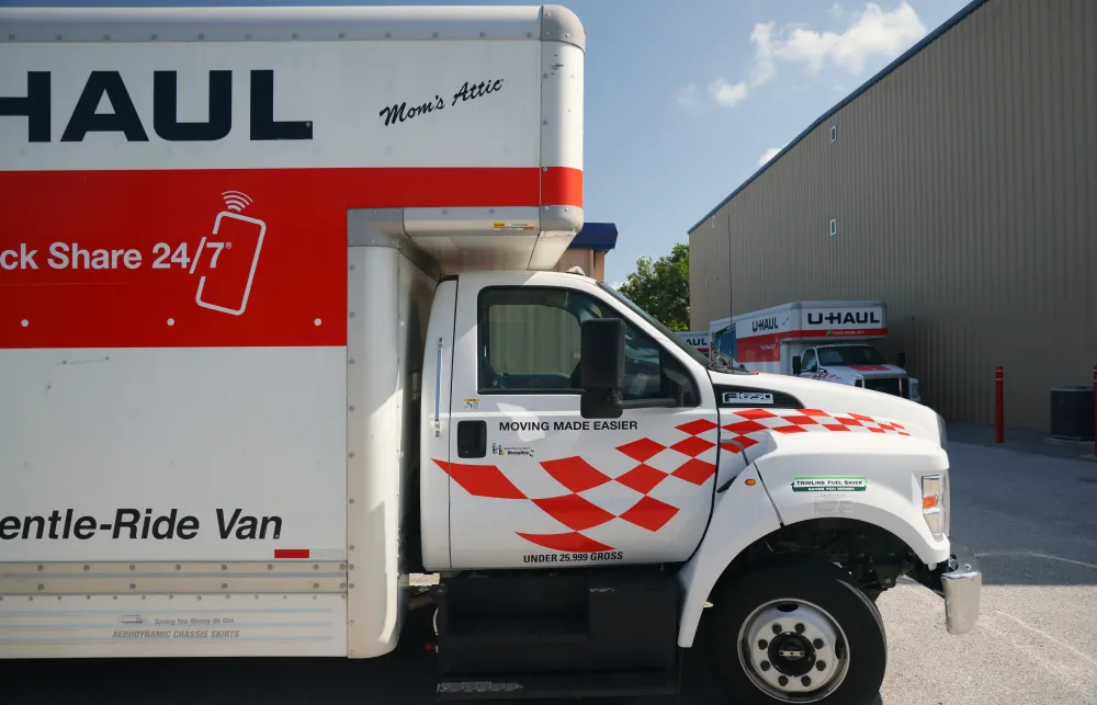 a white truck with a red stripe