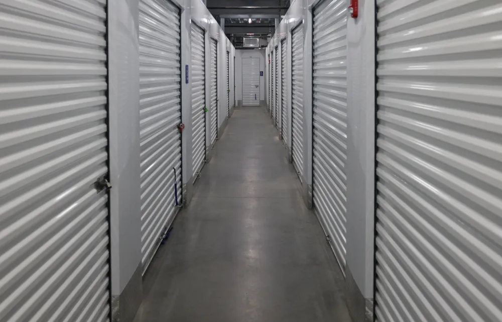 a long hallway with rows of computer servers