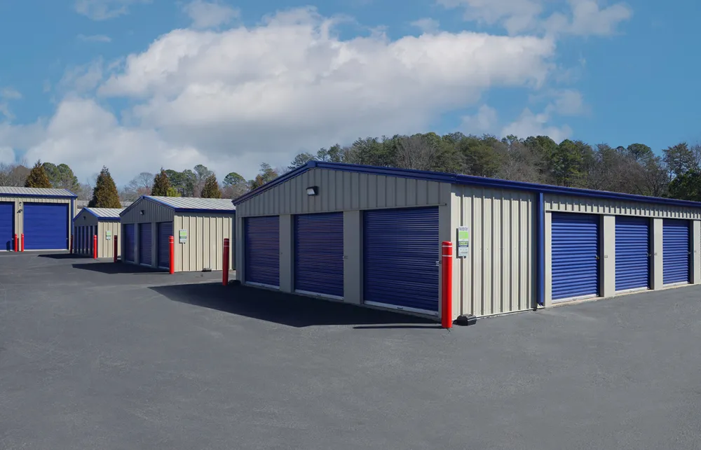 a row of blue and white sheds