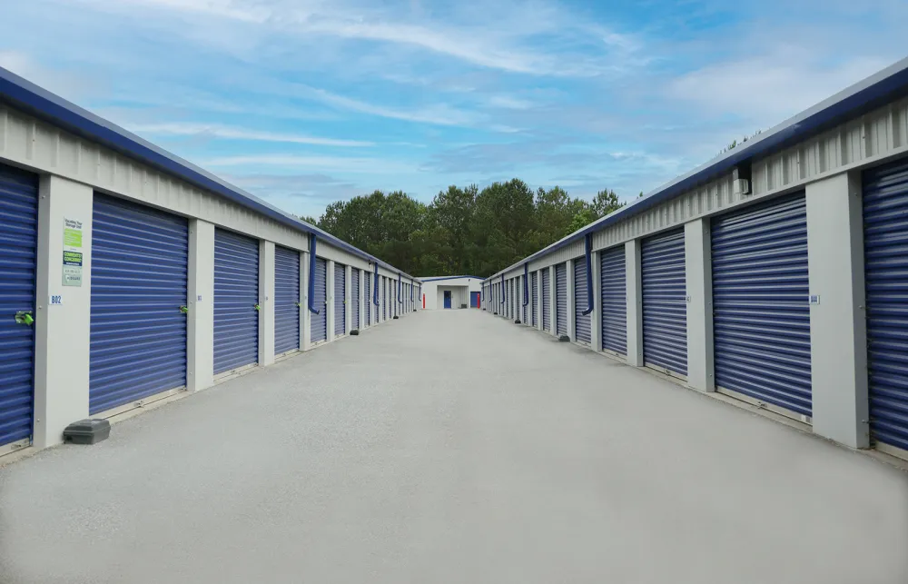 a row of white and blue garages