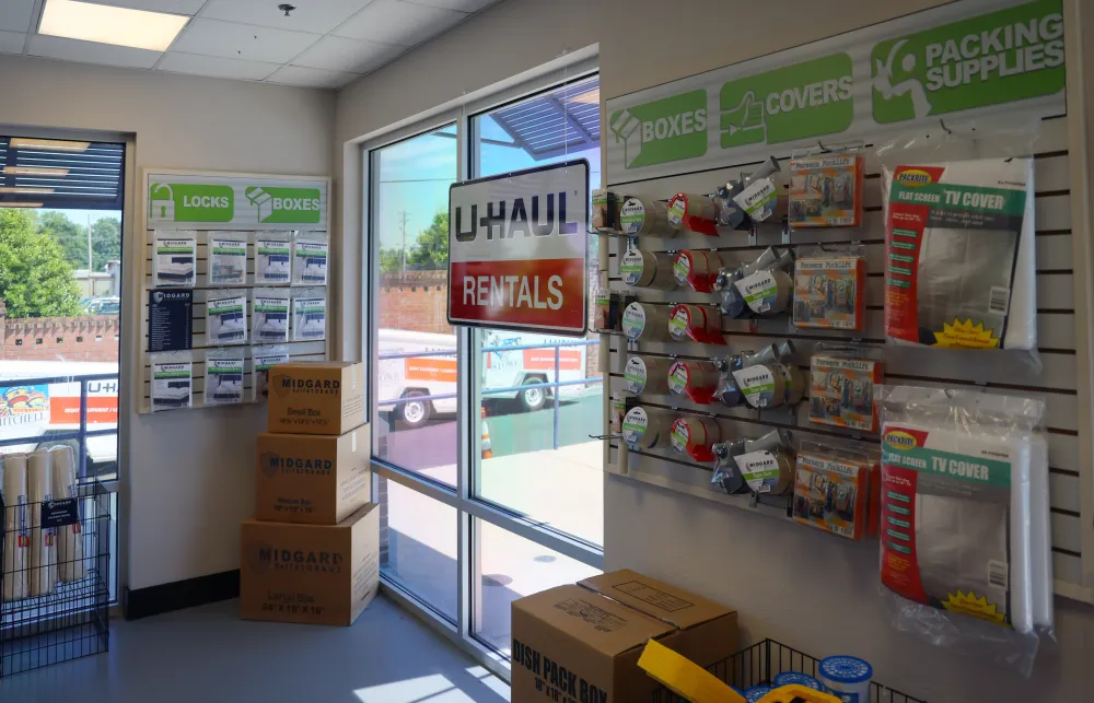 a store front with boxes and signs