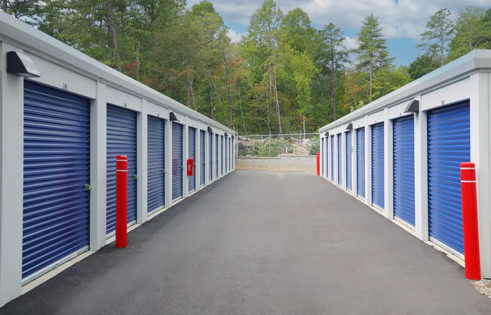 a row of white and blue sheds