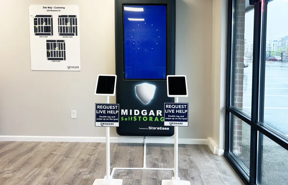 Midgar Self Storage digital kiosk with interactive tablets for live help requests inside facility lobby.