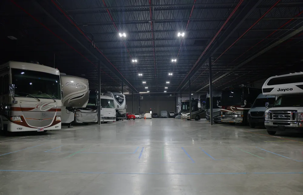 a group of vehicles parked in a large room