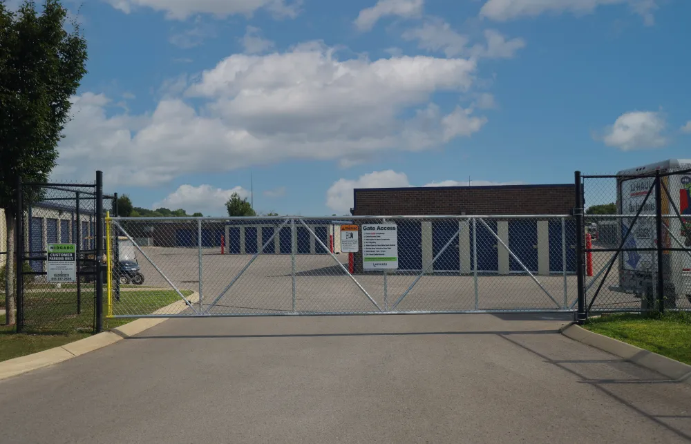 a gated off area with a building in the background