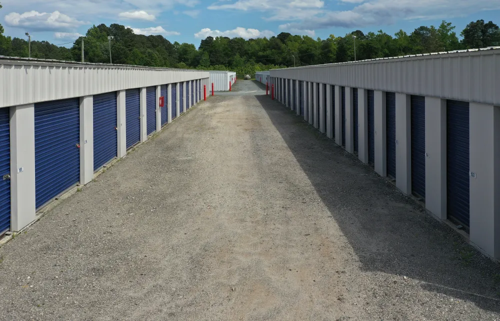 a long row of white and blue metal fences