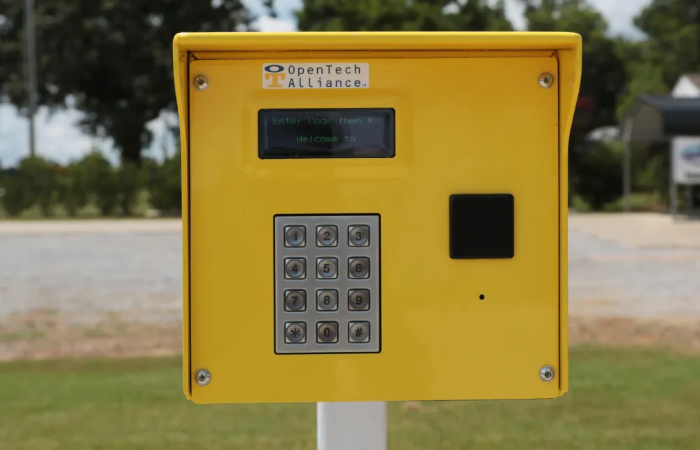 a yellow mailbox on grass