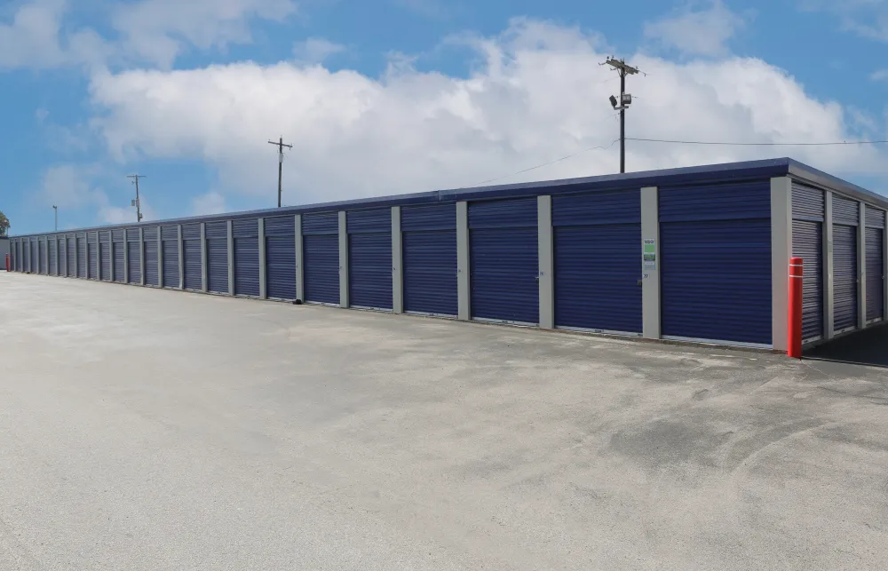 a row of blue and white shipping containers