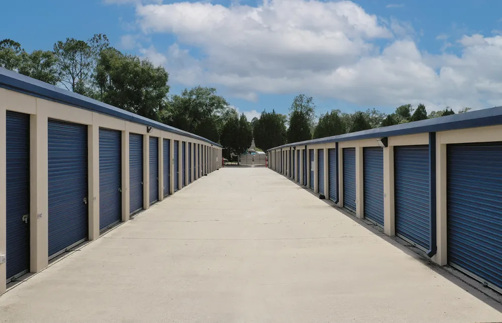 a row of blue and white garage doors