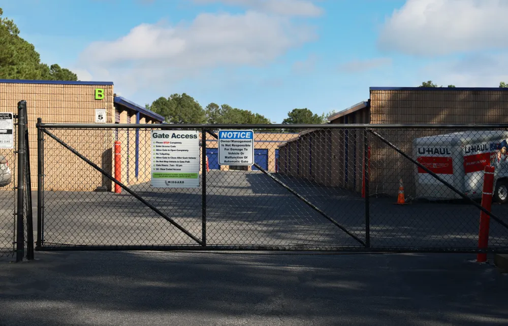 a fenced off area with a sign on it