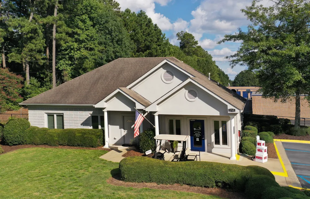 a house with a lawn and a flag in the front