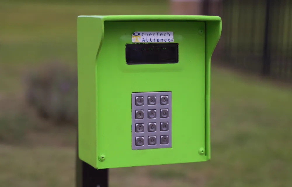 a green and black telephone