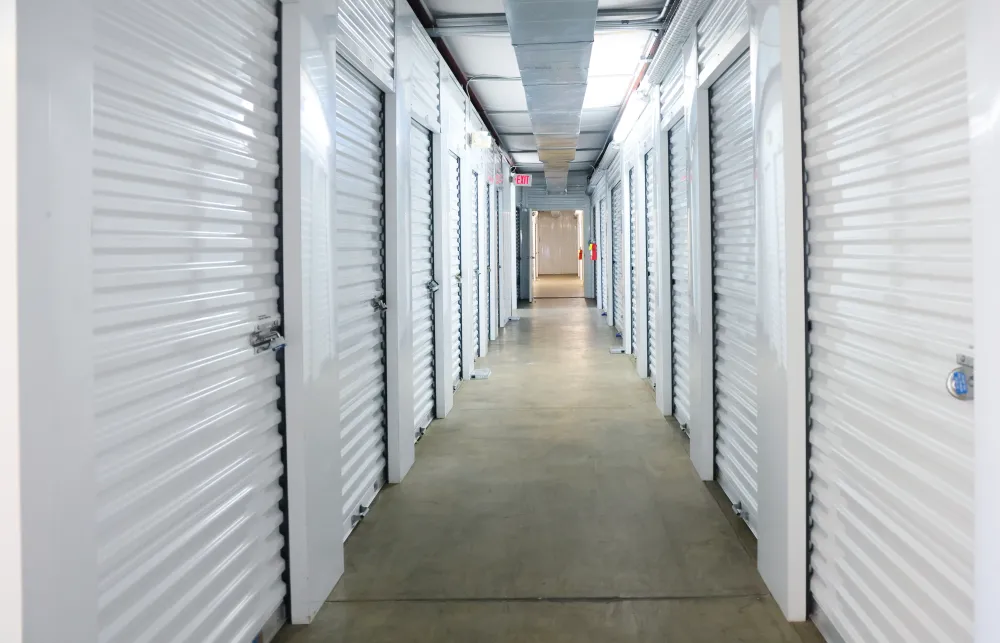 a hallway with white lockers