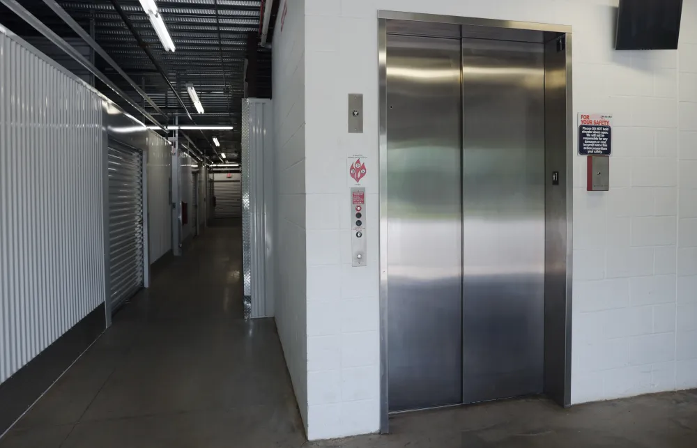 a hallway with metal doors