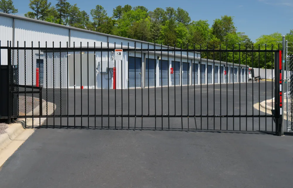 a black gate with a metal fence