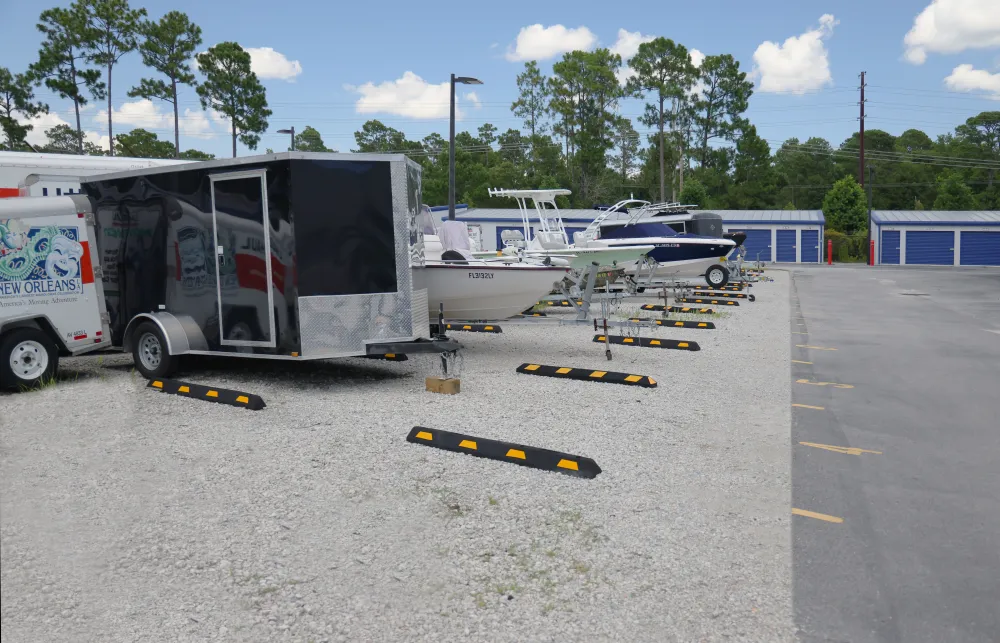 a trailer parked next to a boat