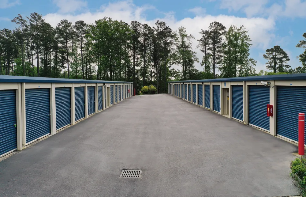 a row of blue and white sheds