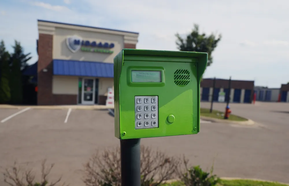 a green mailbox on a street