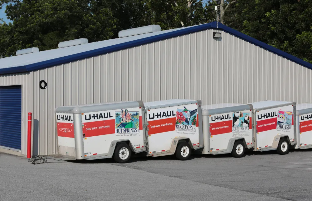 a group of semi trucks parked outside a building