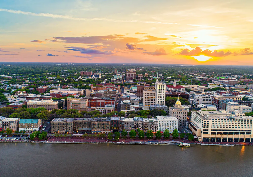 a large body of water with a city in the background