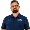 Man wearing navy blue PV Heating Cooling Plumbing polo and khaki pants with brown shoes and glasses