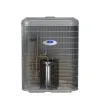 Gray Carrier Infinity air conditioner unit with visible internal copper pipes and compressor against white background