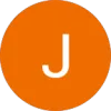 White letter J centered on solid orange circular background