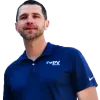 a man wearing a blue shirt and white pants