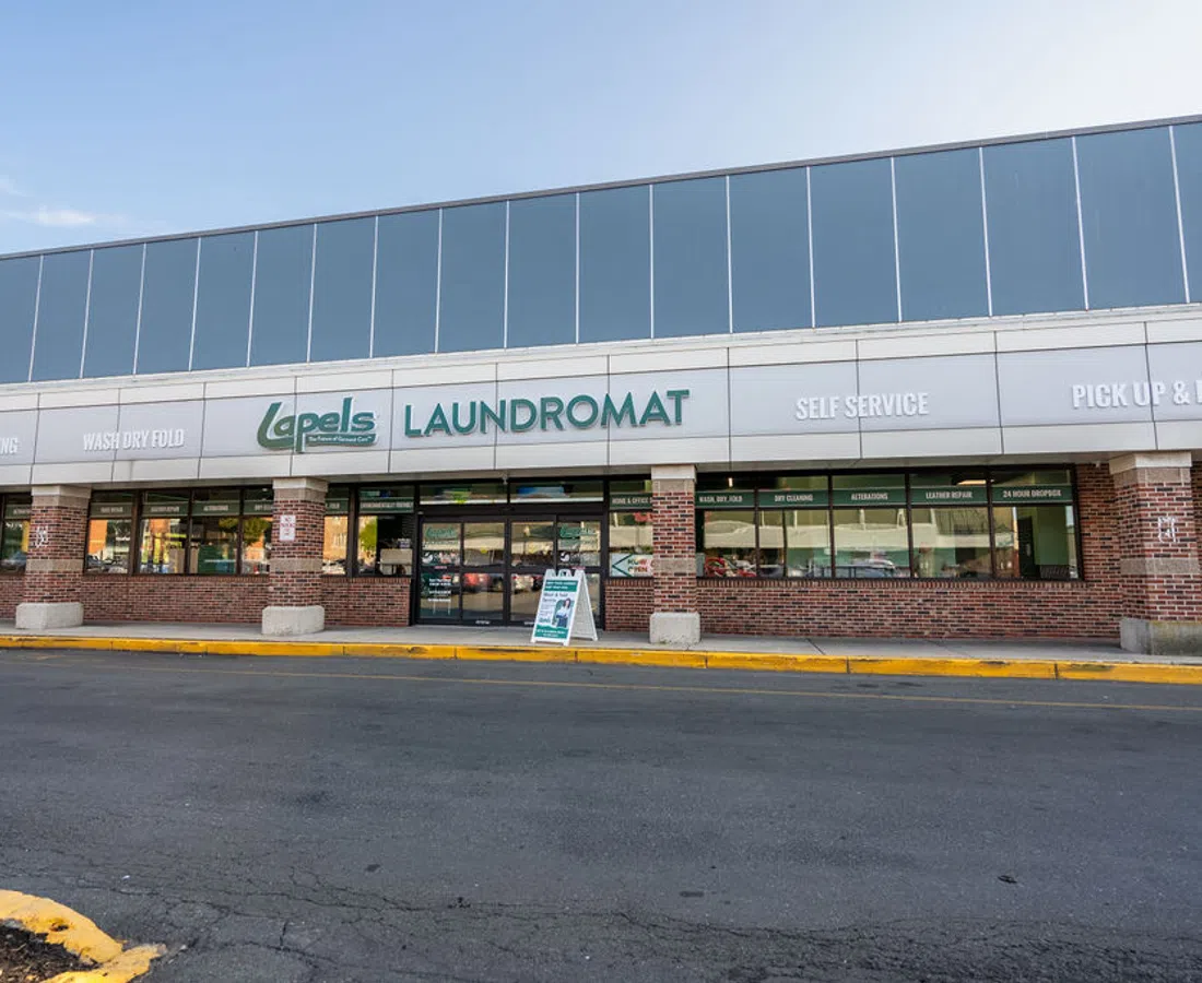 Lapel's Laundromat storefront with services including dry cleaning, wash dry fold, self-service, and pick up delivery.