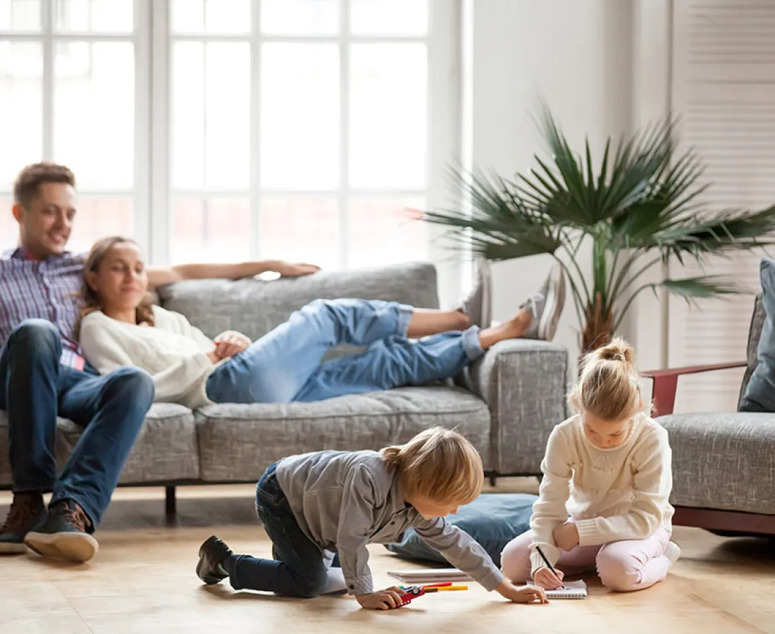 a family sitting on the floor