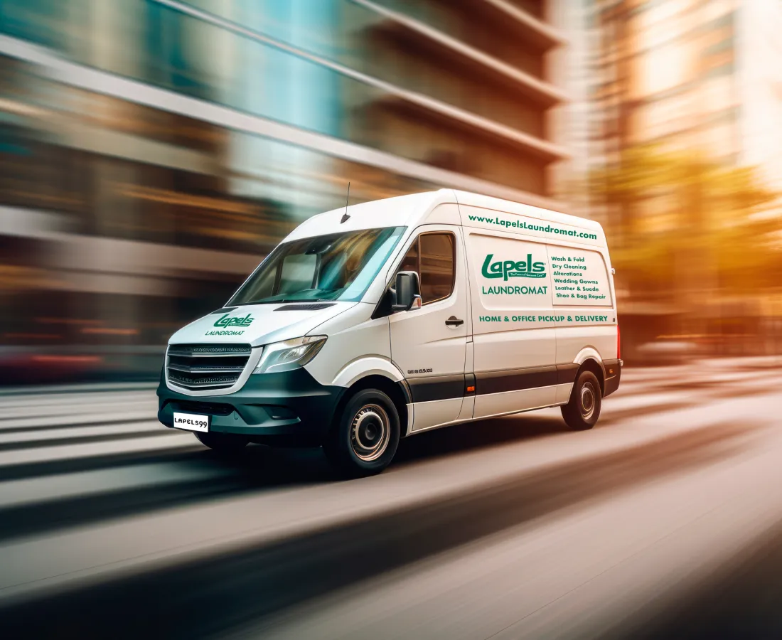 White Lapels Laundromat delivery van speeding through city streets during sunset with motion blur effect