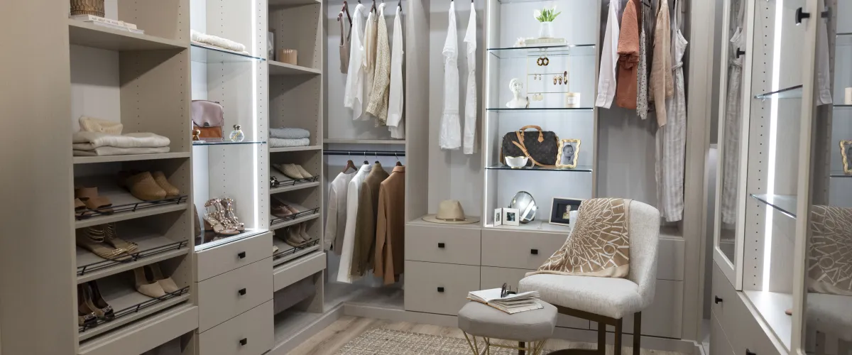 a custom designed female closet with luxury handbags and shoes and designer clothes