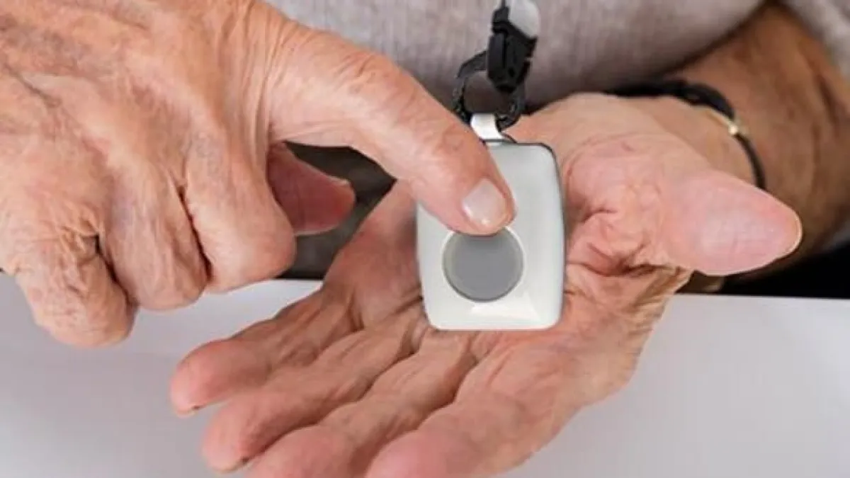 a person holding a white device