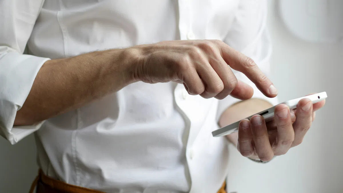 a man holding a tablet