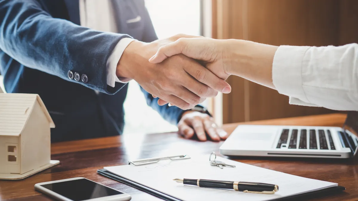 a man and a woman shaking hands