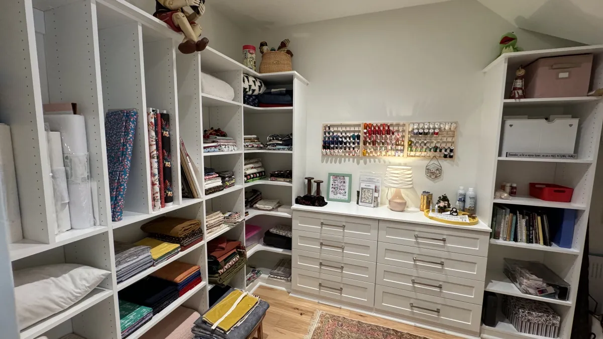 a room with shelves and a chair