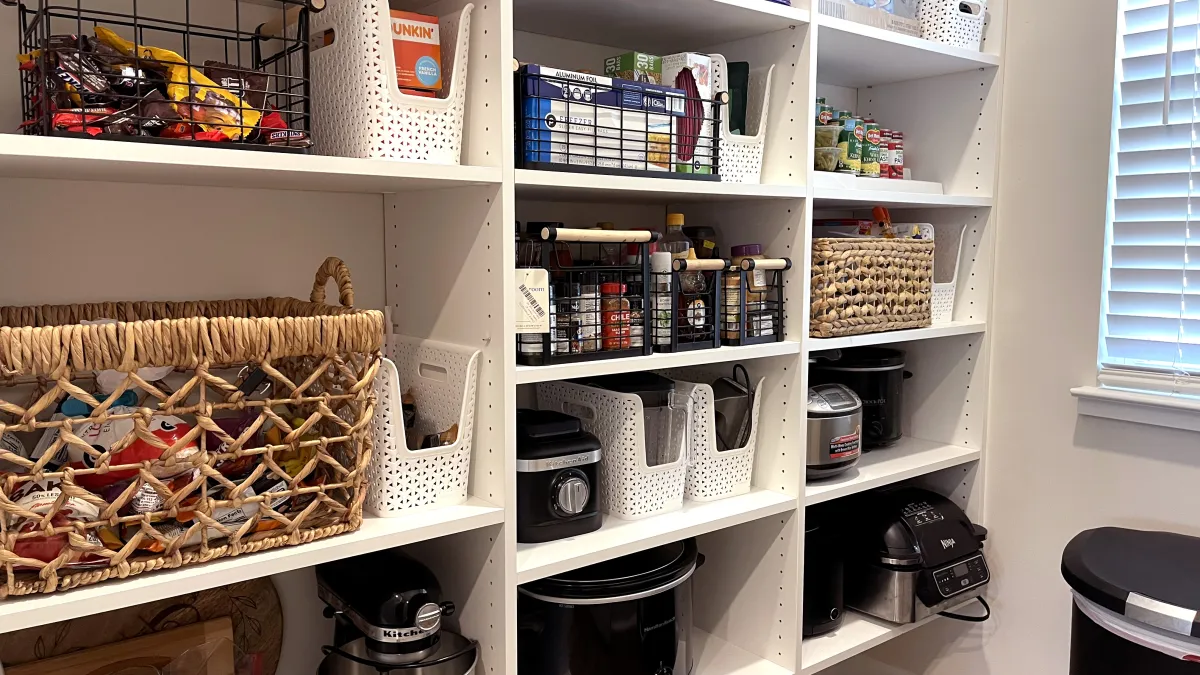 a white shelving unit with various items on it