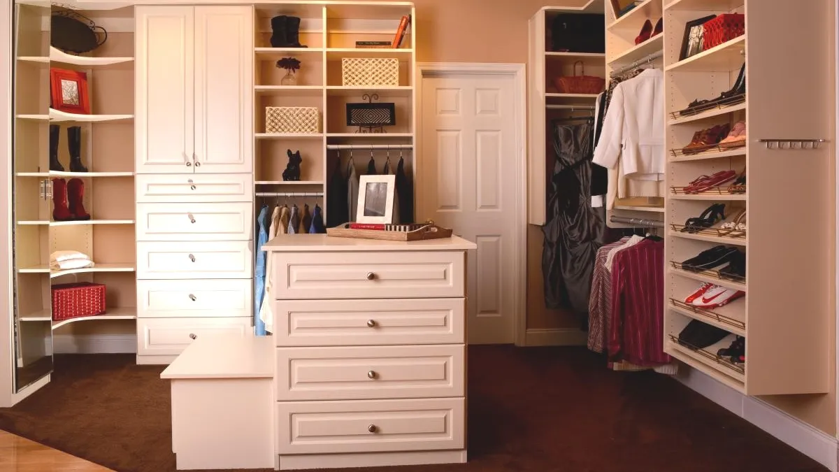 a closet with white drawers