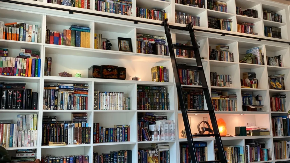 a shelf with many books on it