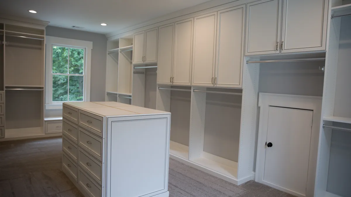 a kitchen with white cabinets