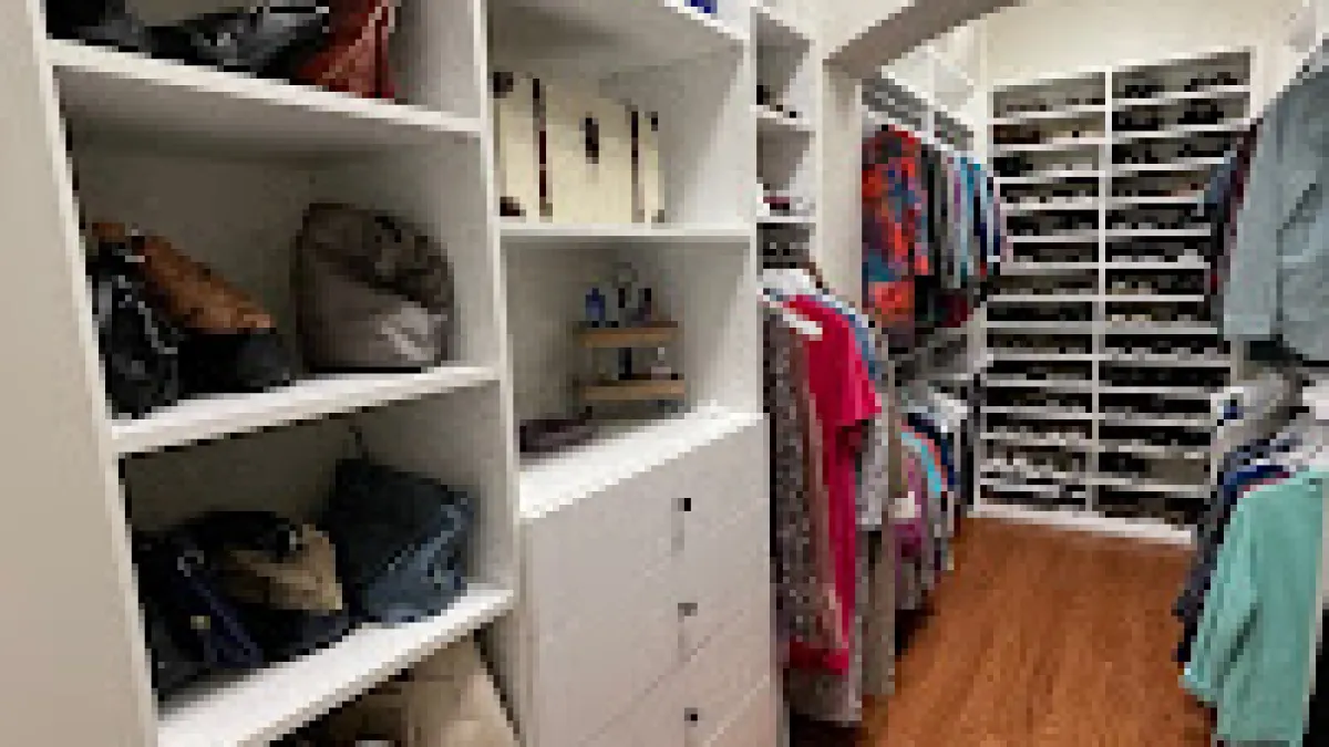 a closet with shelves and a door